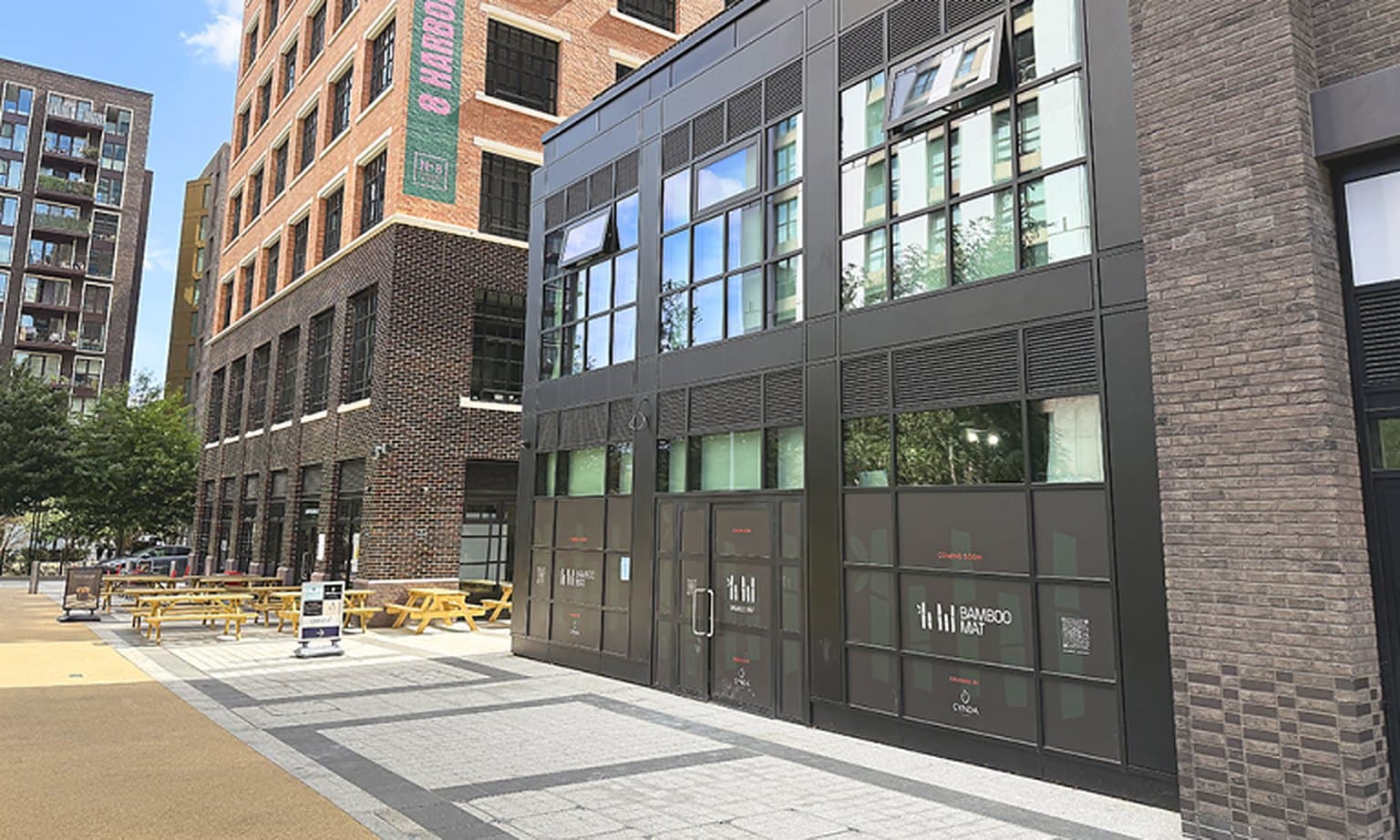 Bamboo Mat restaurant frontage at Canary Wharf, with the terrace and the glazed façade behind